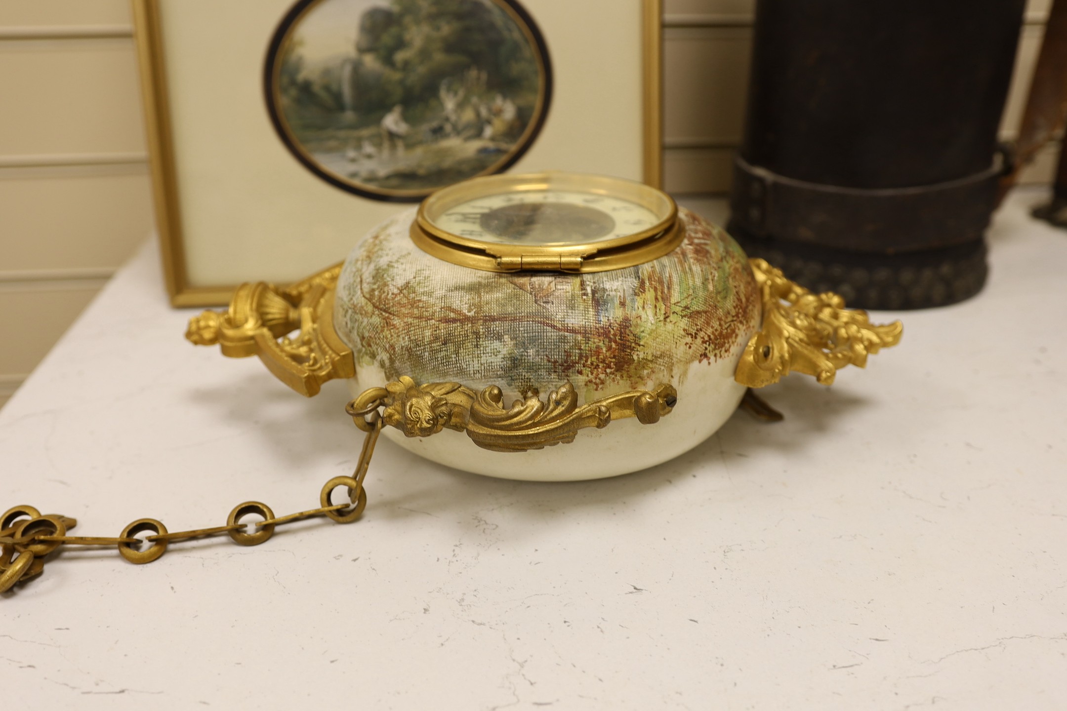 A late 19th century French ornate ceramic and gilt brass wall clock, 35cm tall